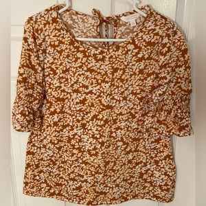 LC Lauren Conrad orange and white top, leaf pattern, keyhole back, size S